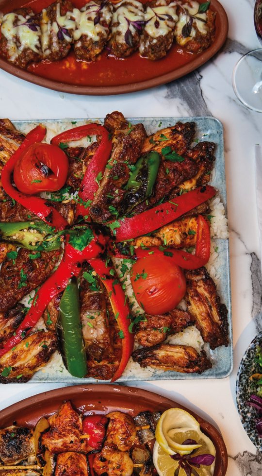 Best Turkish restaurant in Kingston, Milton Keynes Close up of hummus drizzled with oil and adana kebabs on flatbreads